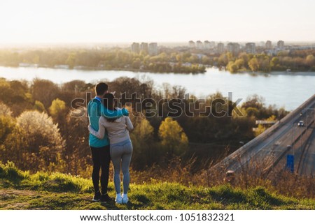 Happy young sporty couple sharing romantic moments