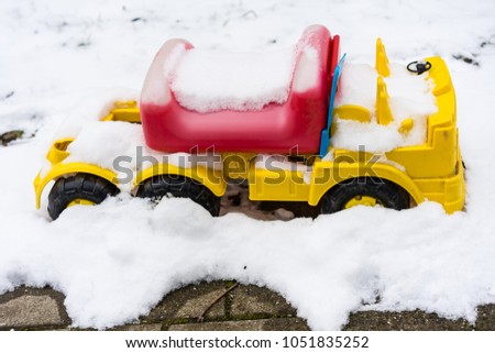 bobby car covered in snow