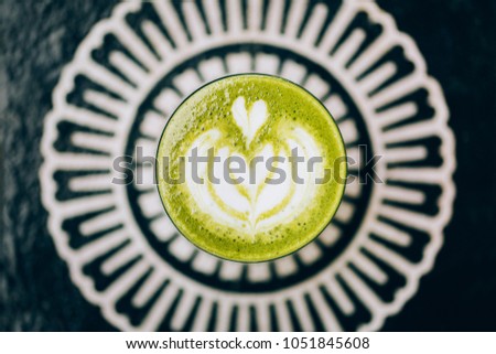 Trendy green latte. Avocado or matcha taste with latte art.