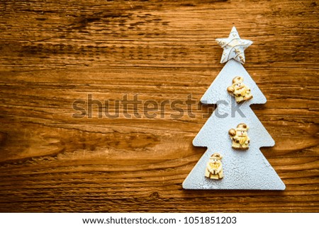 christmas card - snowy christmas tree with star, fir on wooden texture background. empty copy space for inscription or objects. 
