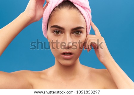 woman with a pink towel on her head, hair care                           