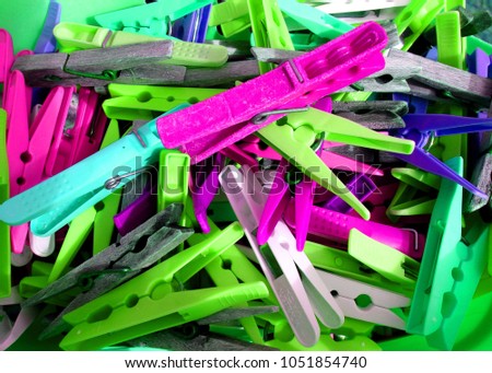 Colourful plastic pegs without primary colors
