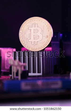Picture of virtual currency, bitcoin and processor on pink background