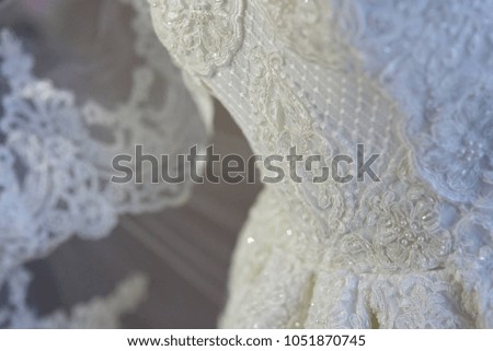 Lace and embroidery with beads on fabric wedding dresses