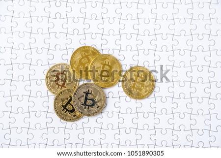 Gold bitcoin on white jigsaw or puzzle, cryptocurrency. Missing jigsaw puzzle pieces. Business solution concept, Key for success concept. Completing finance concept.