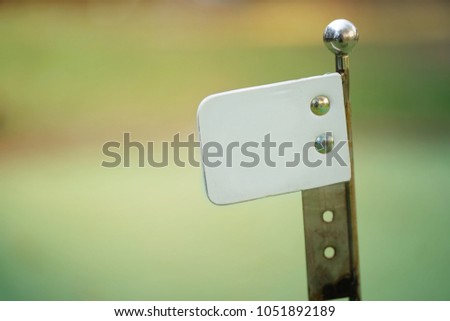 Small sign board with blur background.