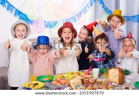 Friendly children having party to celebrate friendâ??s birthday 
