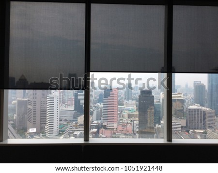 Front view of unfurnished office interior, city view of window