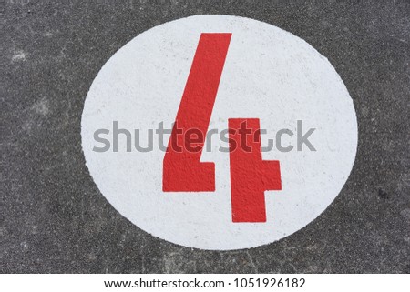 red number four in white circle road sign