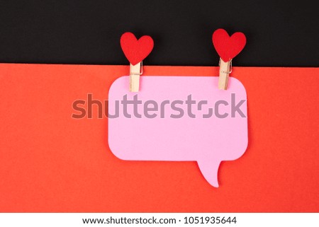 pink note, clothes pegs with hearts                               