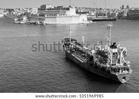 Tank ship designed for transporting liquefied natural fuels in the port of Malta. Black and white picture