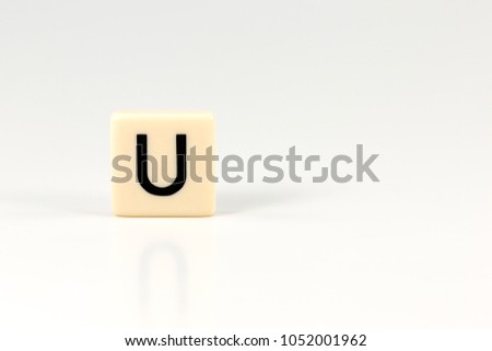 capital letter U on plastic board isolated on white background with copy space