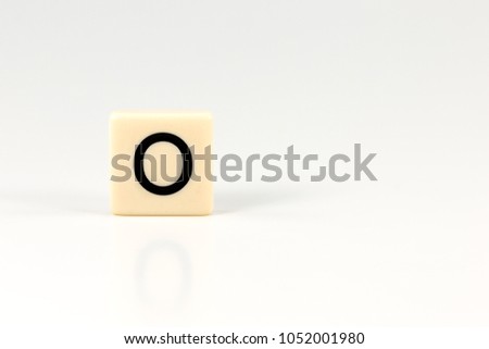 capital letter O on plastic board isolated on white background with copy space