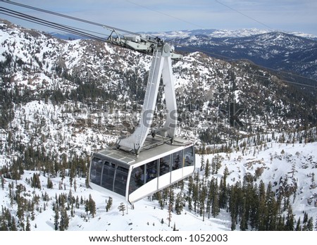 A photo of a gondola coming to the top