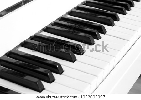White piano. Piano keys