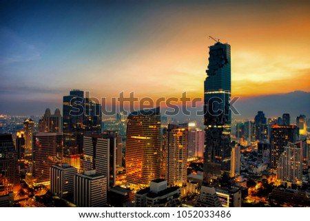 Cityscape at sunset sky by long shutter speed in Bangkok City of Thailand.