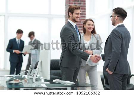 handshake business partners at a meeting Royalty-Free Stock Photo #1052106362