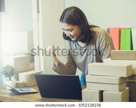 Asian women online seller at her home and she during check new order and stock of product