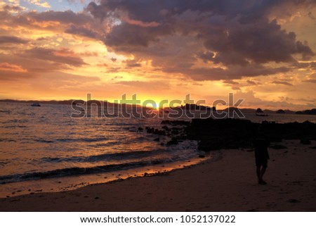 sunset and red sky by the beach 