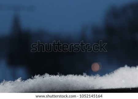 Snowy landscape with lightly blurred snowflakes and beautiful winter climate.