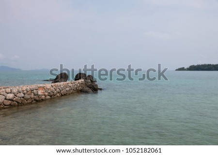 sea and beach with stone at coast