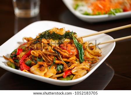 Thai Drunken Noodles Royalty-Free Stock Photo #1052183705