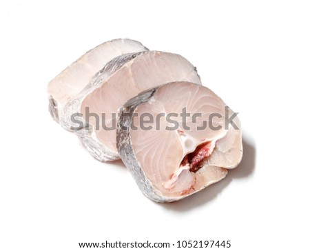 Pieces of fresh raw hake fish isolated on white background.