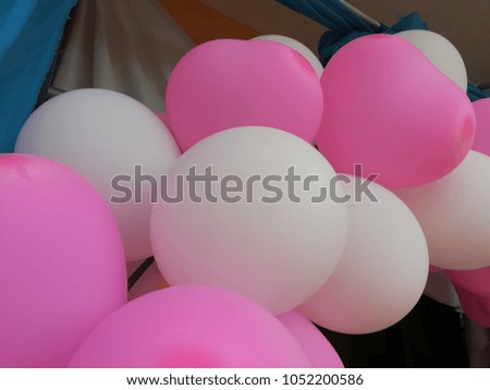 Colorful balloons decorate the building.
