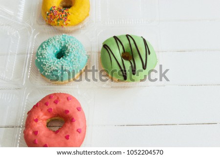 Different frosting fried american donuts white background