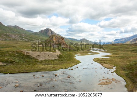 tundra landscape with a creek from greenland in the summer month near sisimiut