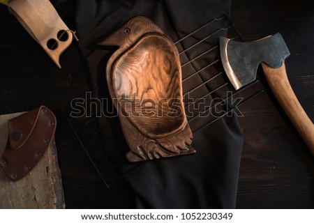 still life - carving axe and a wooden dish
