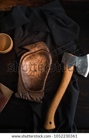 still life - carving axe and a wooden dish