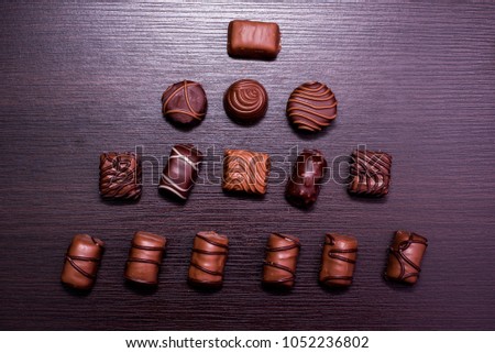 coffee and chocolate candies on a black background