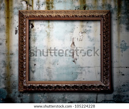 Old picture frame on wall grunge.