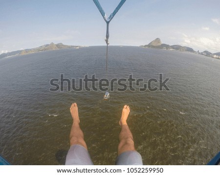 Man takes a POV selfie picture while parasailing in Guanabara Bay, Rio de Janeiro, Brazil