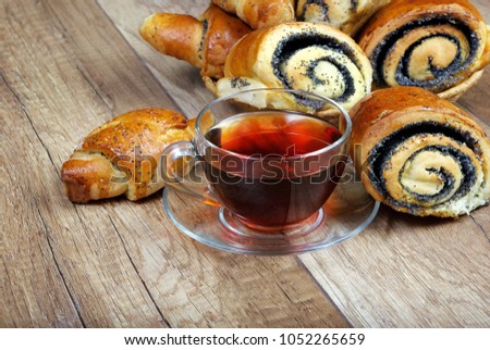 buns with poppy seeds and a cup of tea