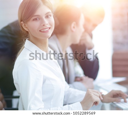 young employee sitting at a Desk