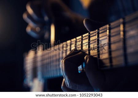 Rock concert, a musician is playing the guitar
