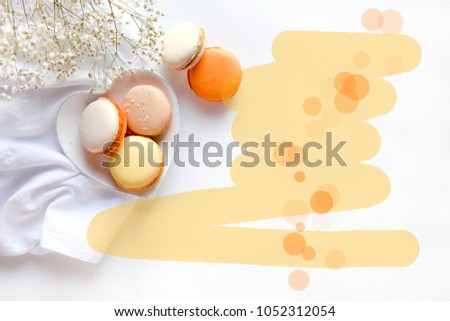 Sweet tasty macaroons white background pastel colors and flowers, spring breakfast