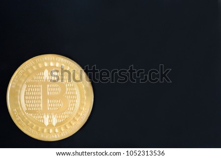 Bitcoin coin isolated on black background with copy space for text. Cryptocurrency smart contract technology concept photo.