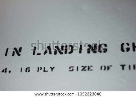 "in Landing" sign on the side of a jet