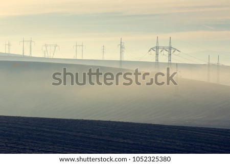 Awesome view of plowed farmland. Autumn dawn in pastel colors. Agricultural themed background.