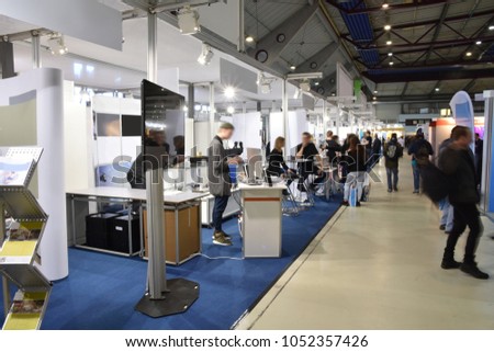 trade fair with different booths Royalty-Free Stock Photo #1052357426