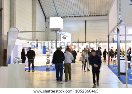 trade fair with different booths Royalty-Free Stock Photo #1052360465