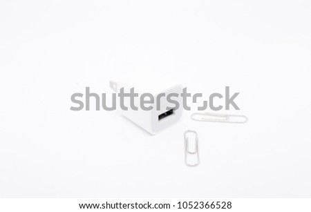 Charger  with usb port and silver paper clip  on white background