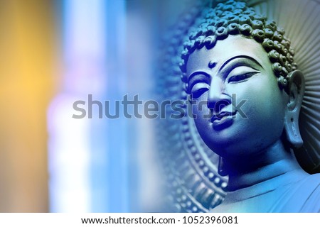 Buddha face On the blue backdrop