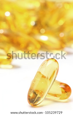 Omega 3 in gold capsule, pills isolated