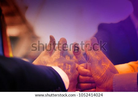 Bitcoin business future life join company,uncertainty with bitcoin in hand,war of success,pull  golden coin with hand to hand,on bokeh,white,blue,purple light background,thumb up to success