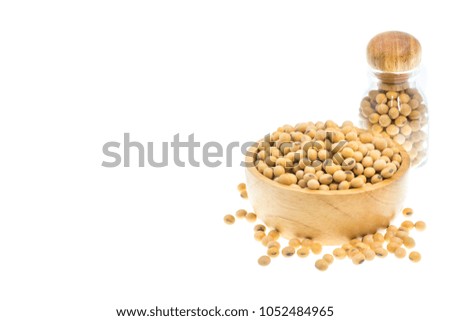 Soybean or soya in a wooden bowl isolated on white background, copy space