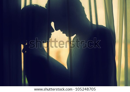 A couple In Love behind a curtain